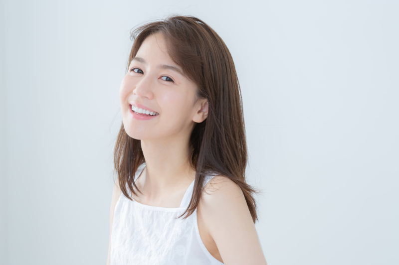 根管治療をして痛みがなくなった笑顔の女性